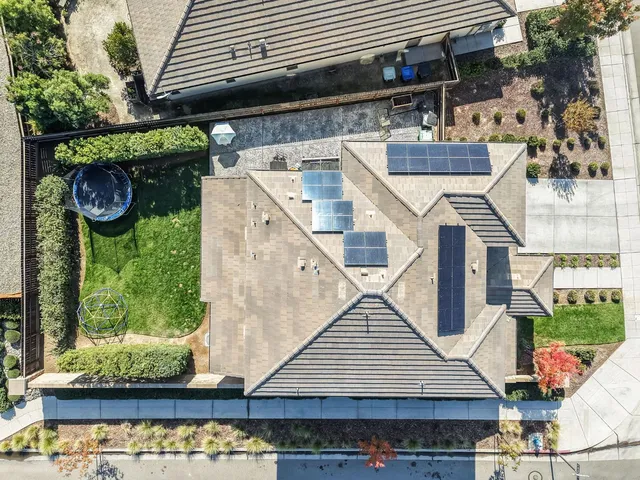 an aerial view of residential houses with outdoor space