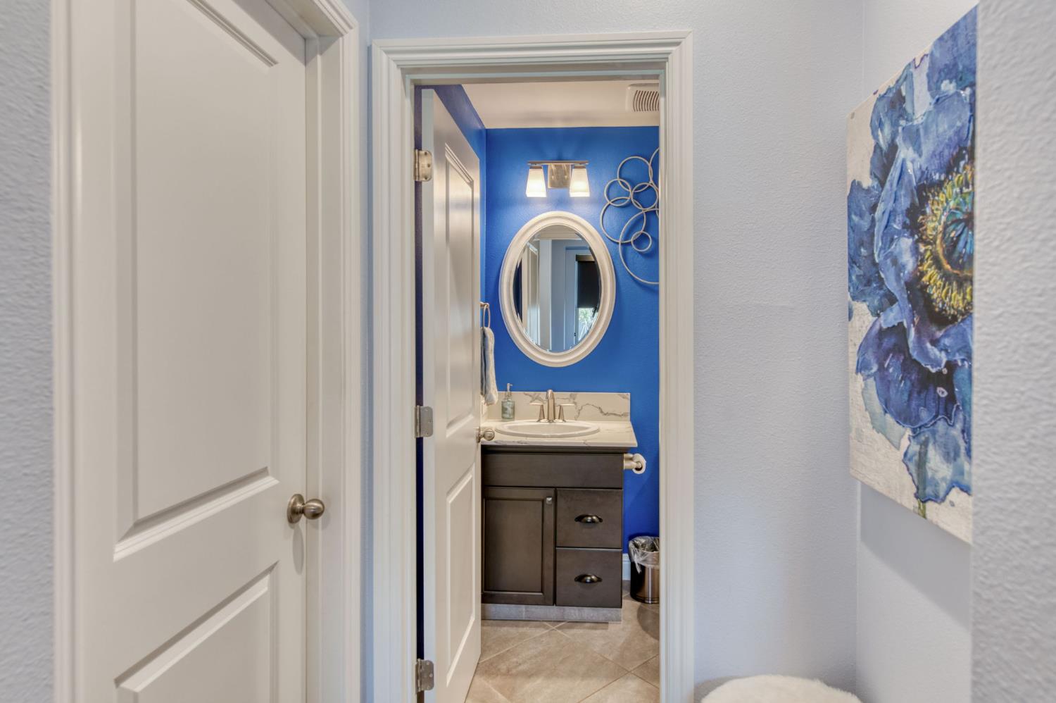 273 Meridian Avenue Madera, CA 93636 - Photo 9 of 55 a bathroom with a toilet and a sink