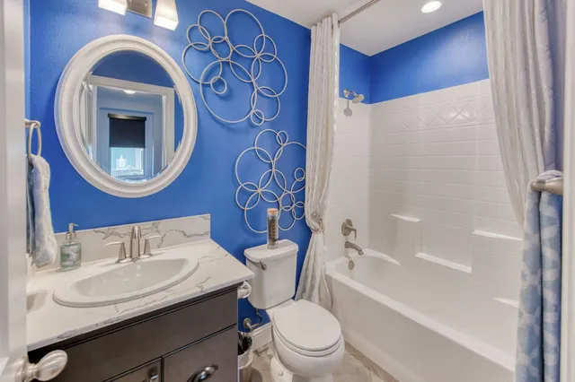 a bathroom with a toilet a sink and a bathtub