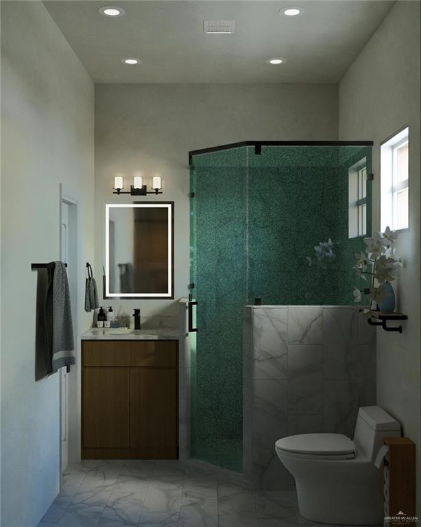 2905 Santa Amanda, Unit 2 Weslaco, TX 78596 - Photo 8 of 11 a bathroom with a toilet sink and mirror