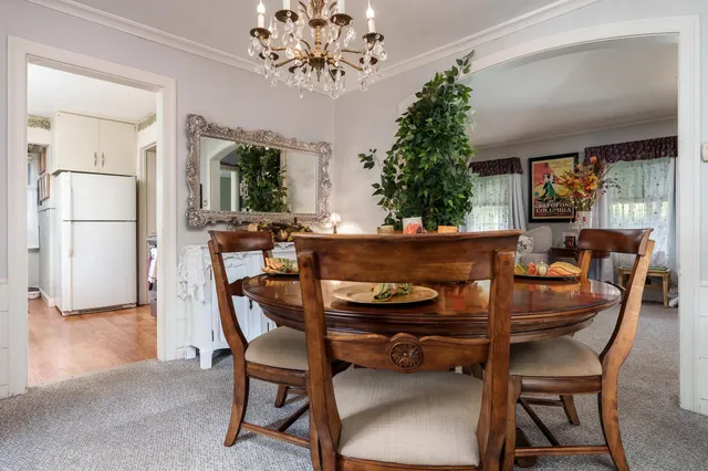 a view of a dining room with furniture window and outside view