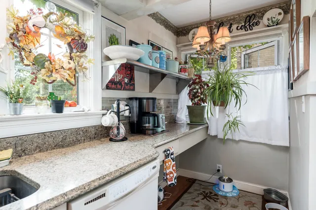 a kitchen with a sink and a stove