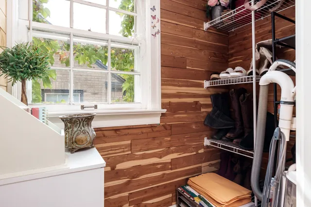 a bathroom with a sink a toilet and a window