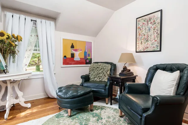 a living room with furniture and a rug