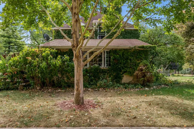 a backyard of a house with lots of green space