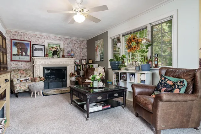 a living room with furniture and a fireplace