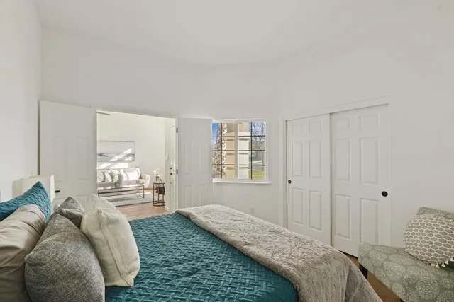 a bedroom with a bed and window