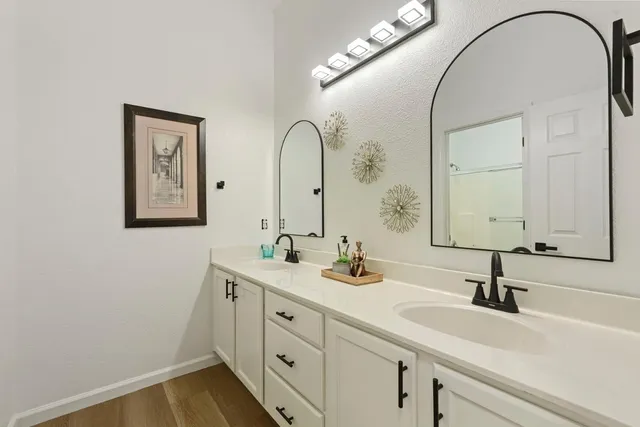 a bathroom with a sink and a mirror