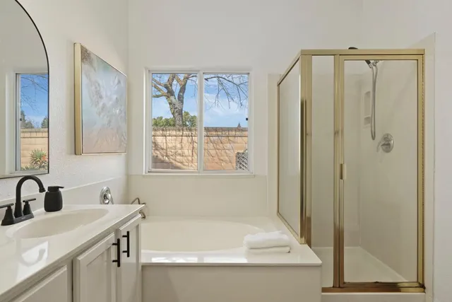a bathroom with a bathtub and a sink
