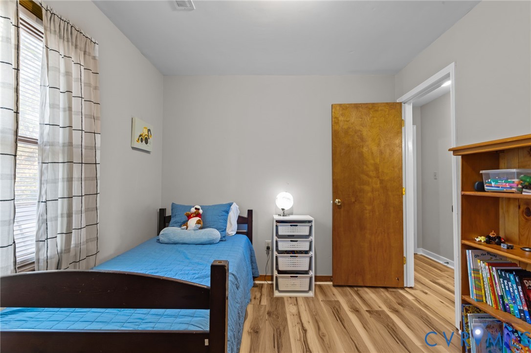 37 La Mae Court Aylett, VA 23009 - Photo 23 of 36 a view of a bedroom with furniture and book shelf