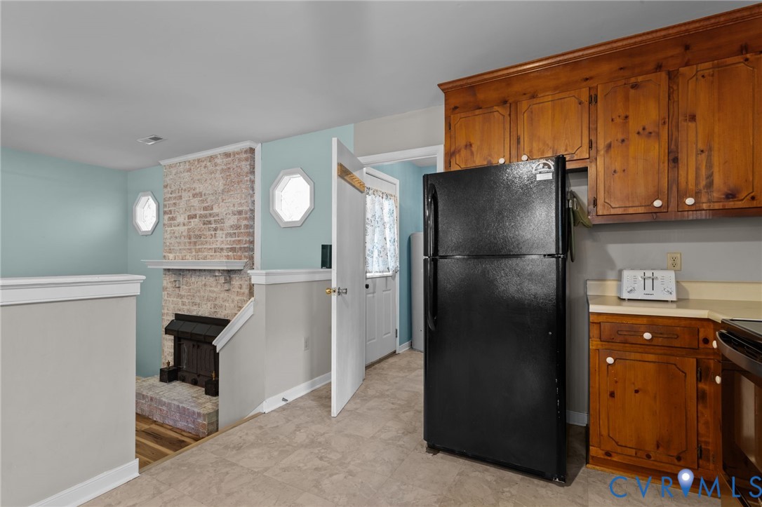 37 La Mae Court Aylett, VA 23009 - Photo 5 of 36 a kitchen with a refrigerator and a sink