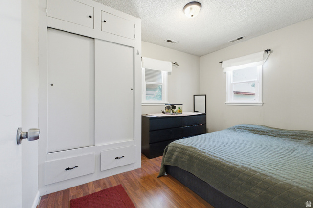 94 West 2000th Street North Clearfield, UT 84015 - Photo 8 of 26 Bedroom with built-in closet storage, two windows, and neutral walls ready for your personal touch.
