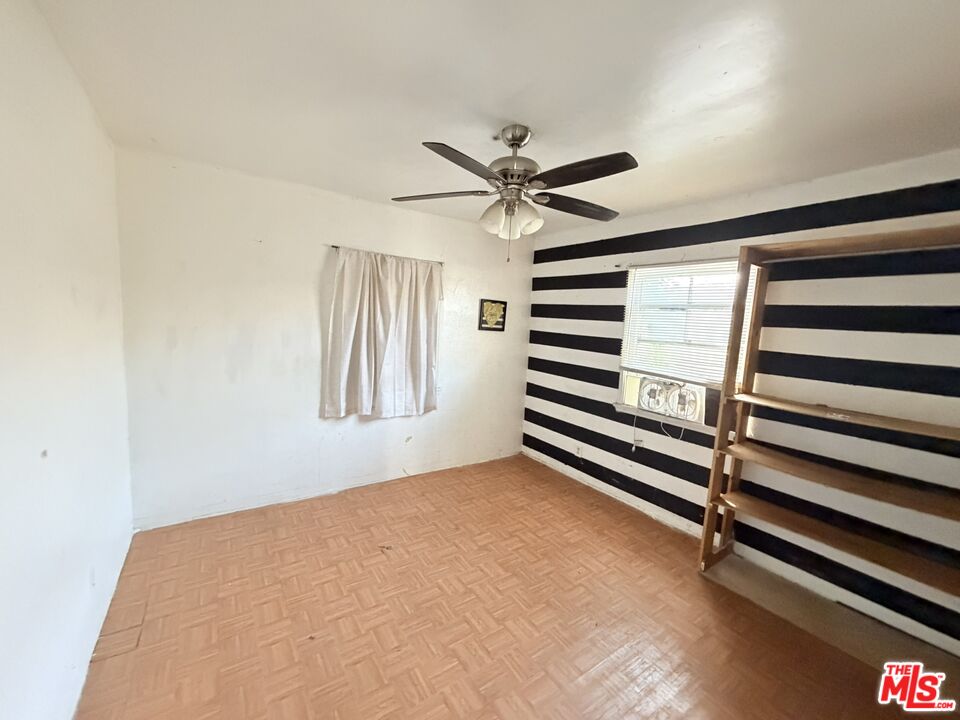 12918 Shreve Road Whittier, CA 90602 - Photo 28 of 42 wooden floor in an empty room with a window