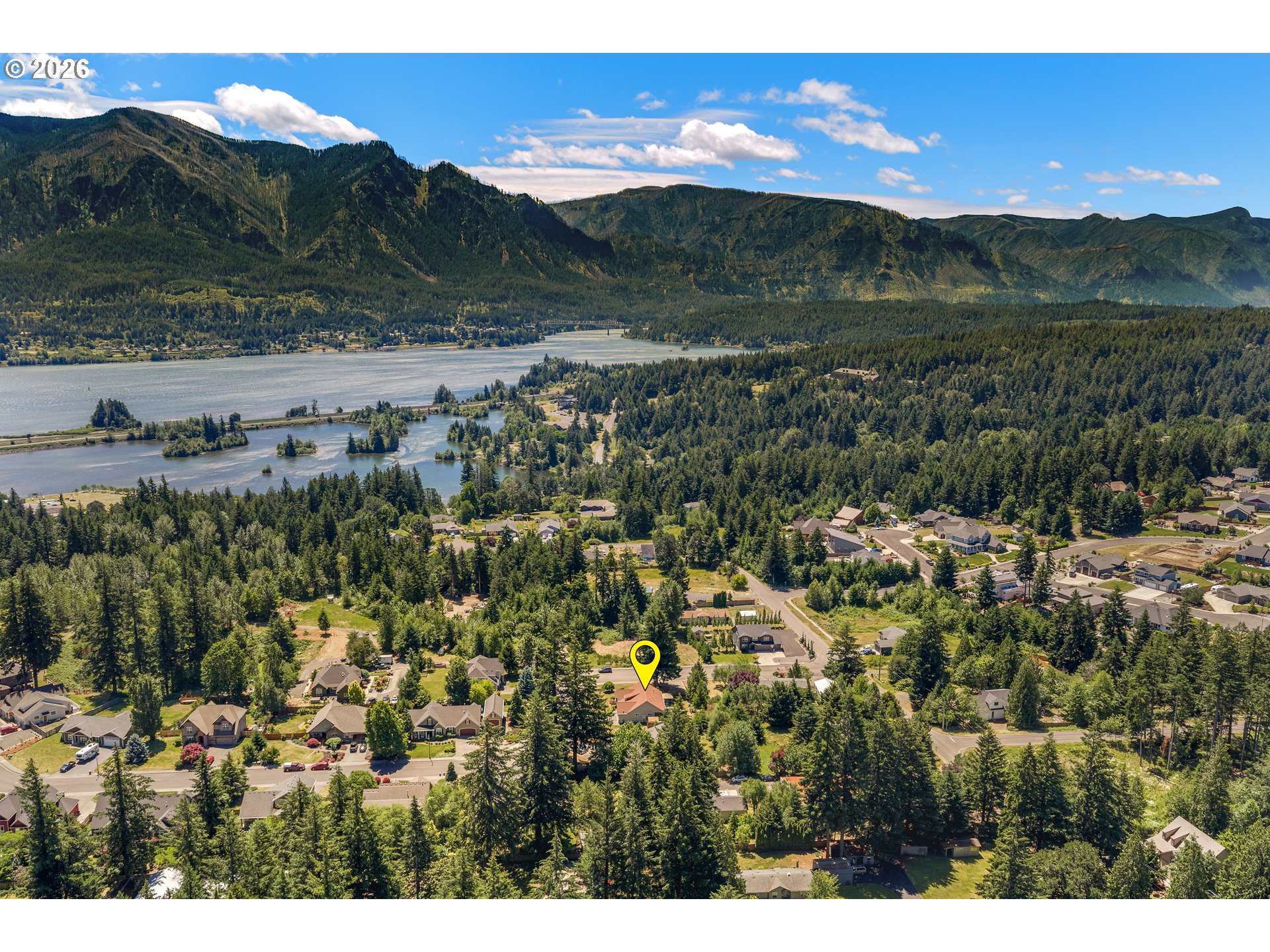 945 Northwest Angel Heights Road Stevenson, WA 98648 - Photo 40 of 41 a view of a lake with mountains in the background