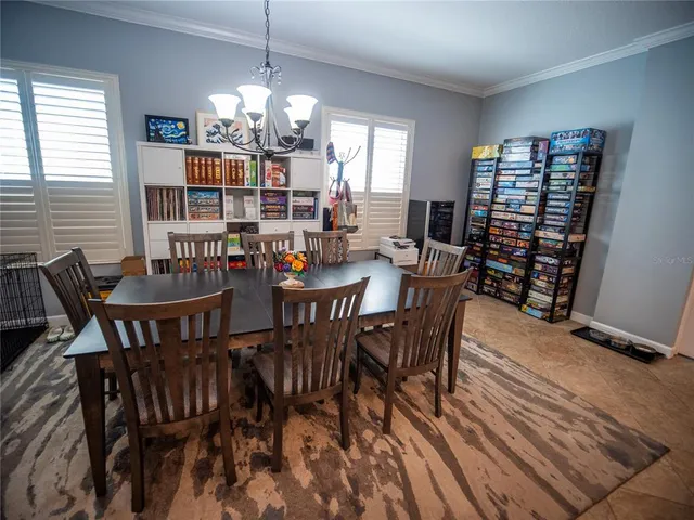 a large kitchen with a table and chairs