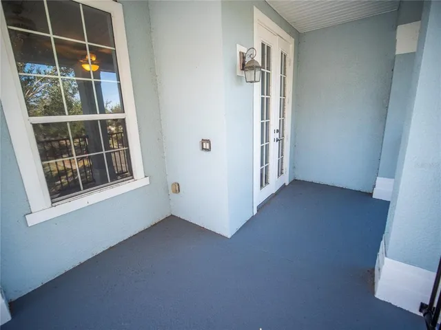 a view of balcony with wooden floor