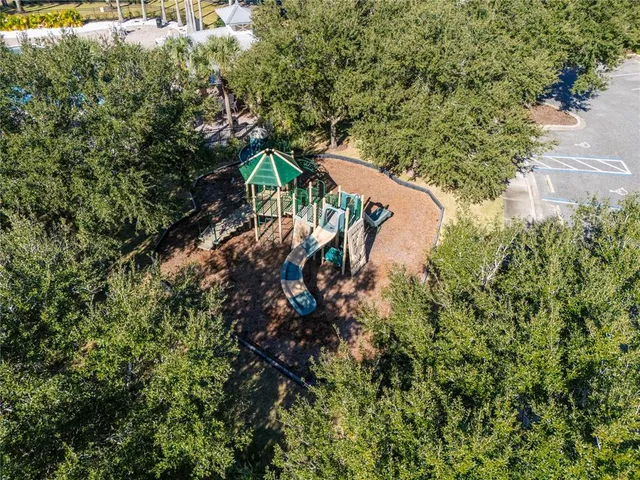 an aerial view of residential houses with outdoor space and swimming pool