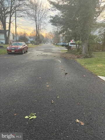 a view of street with parked cars