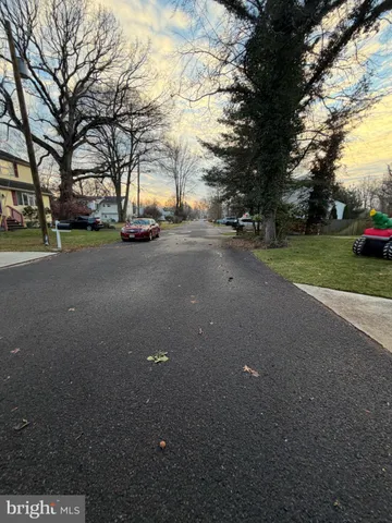 a view of a street with a house