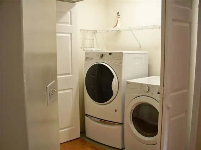 a living room with furniture and a ceiling fan
