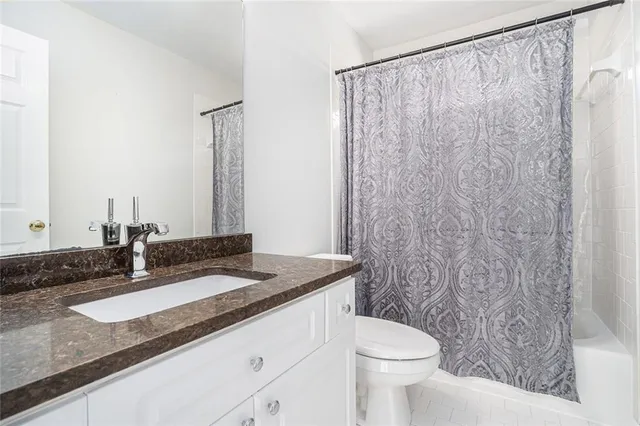 a view of a room with wooden floor and cabinet