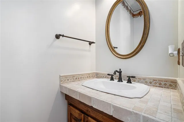 a kitchen with stainless steel appliances granite countertop a stove refrigerator and a microwave