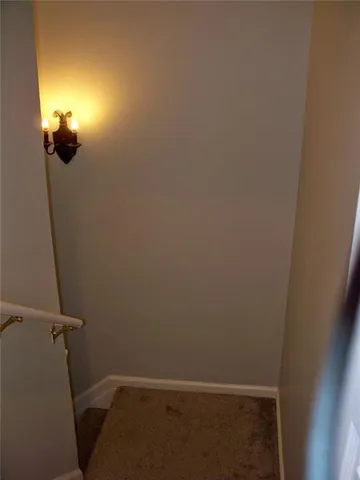 a view of a livingroom with furniture and a flat screen tv