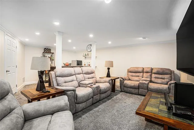 a white toilet sitting next to a bathroom sink