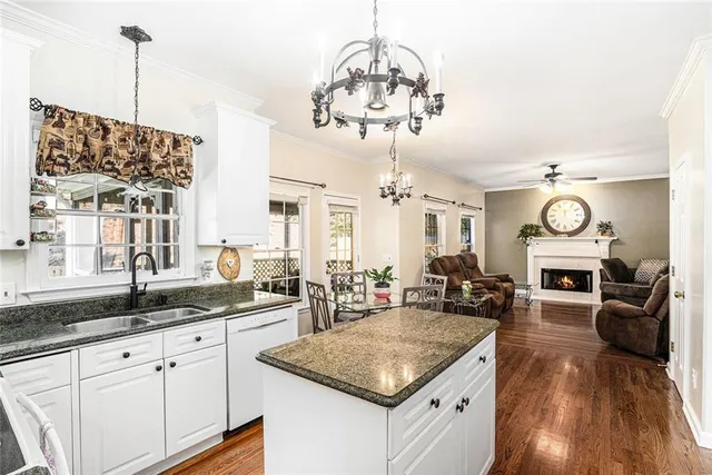 a kitchen with a sink stove and refrigerator