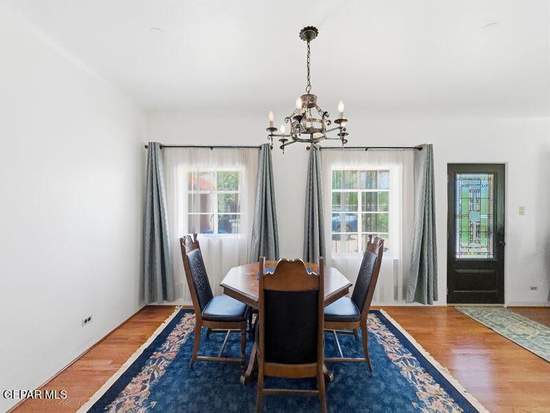 4135 Emory Road El Paso, TX 79922 - Photo 65 of 73 a view of a dining room with furniture window and wooden floor