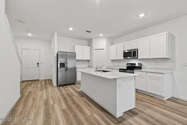 a view of a storage & utility room with washer and dryer