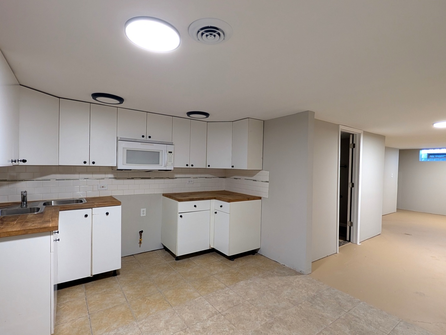14844 Dearborn Street Dolton, IL 60419 - Photo 13 of 15 a kitchen that has a sink a stove and cabinets