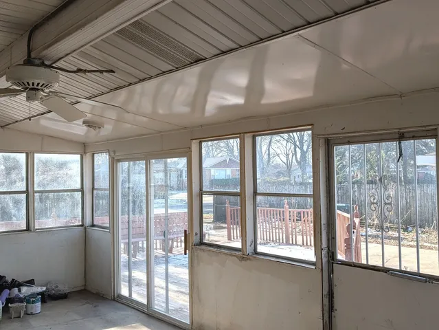 a view of an empty room with a balcony