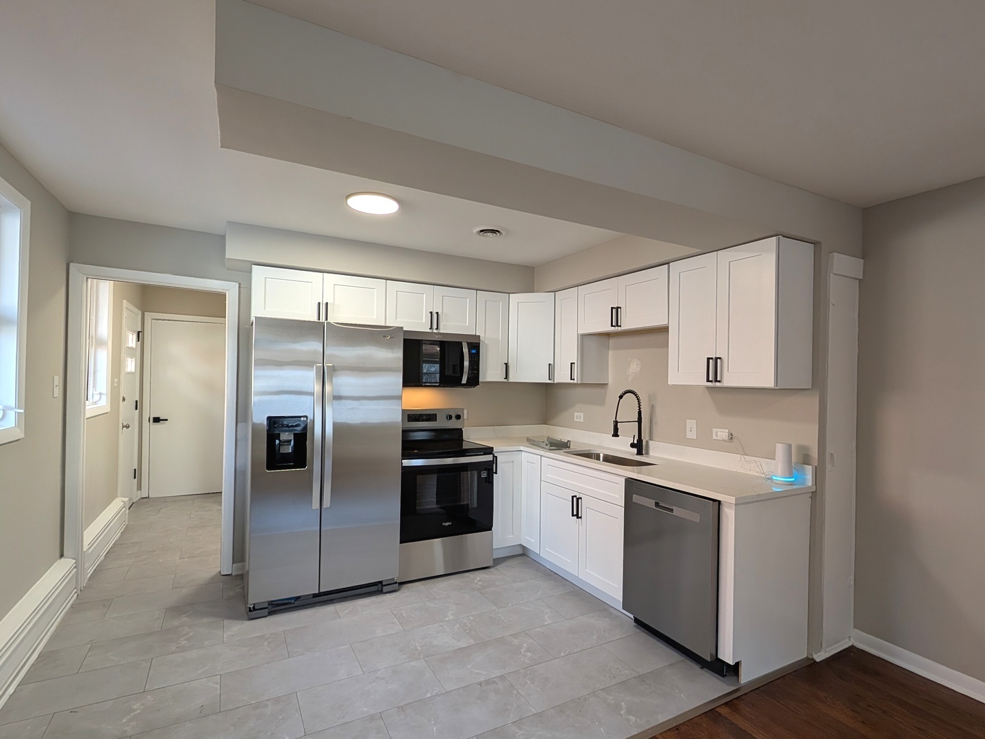 14844 Dearborn Street Dolton, IL 60419 - Photo 6 of 15 a kitchen with stainless steel appliances a refrigerator sink and cabinets