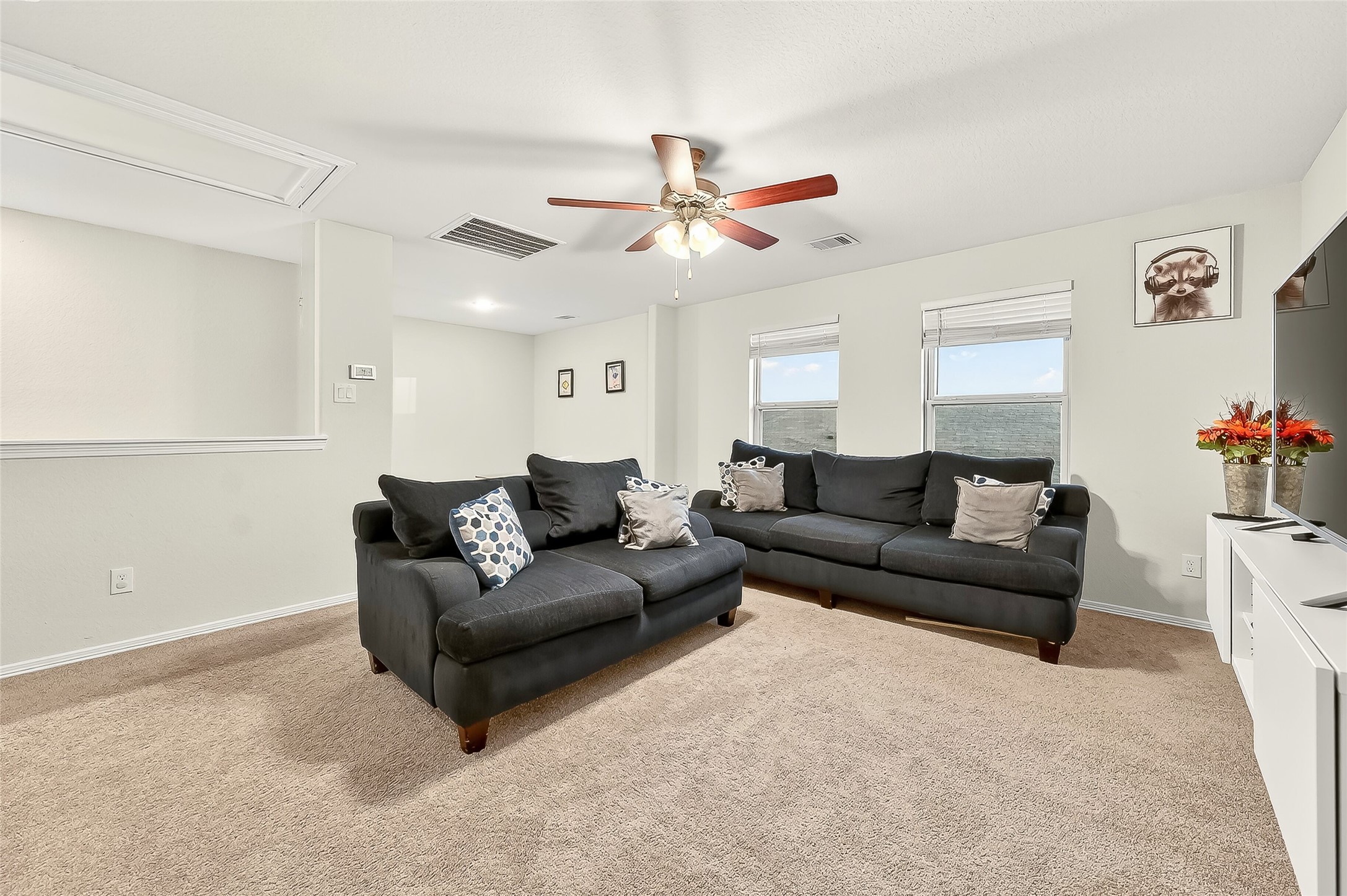 10023 Yanet Grove Lane Houston, TX 77044 - Photo 13 of 40 a living room with furniture and a chandelier