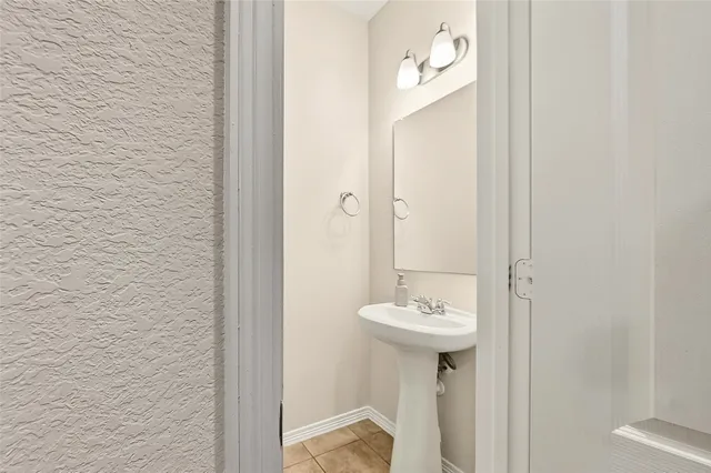 a bathroom with a sink a mirror and a shower