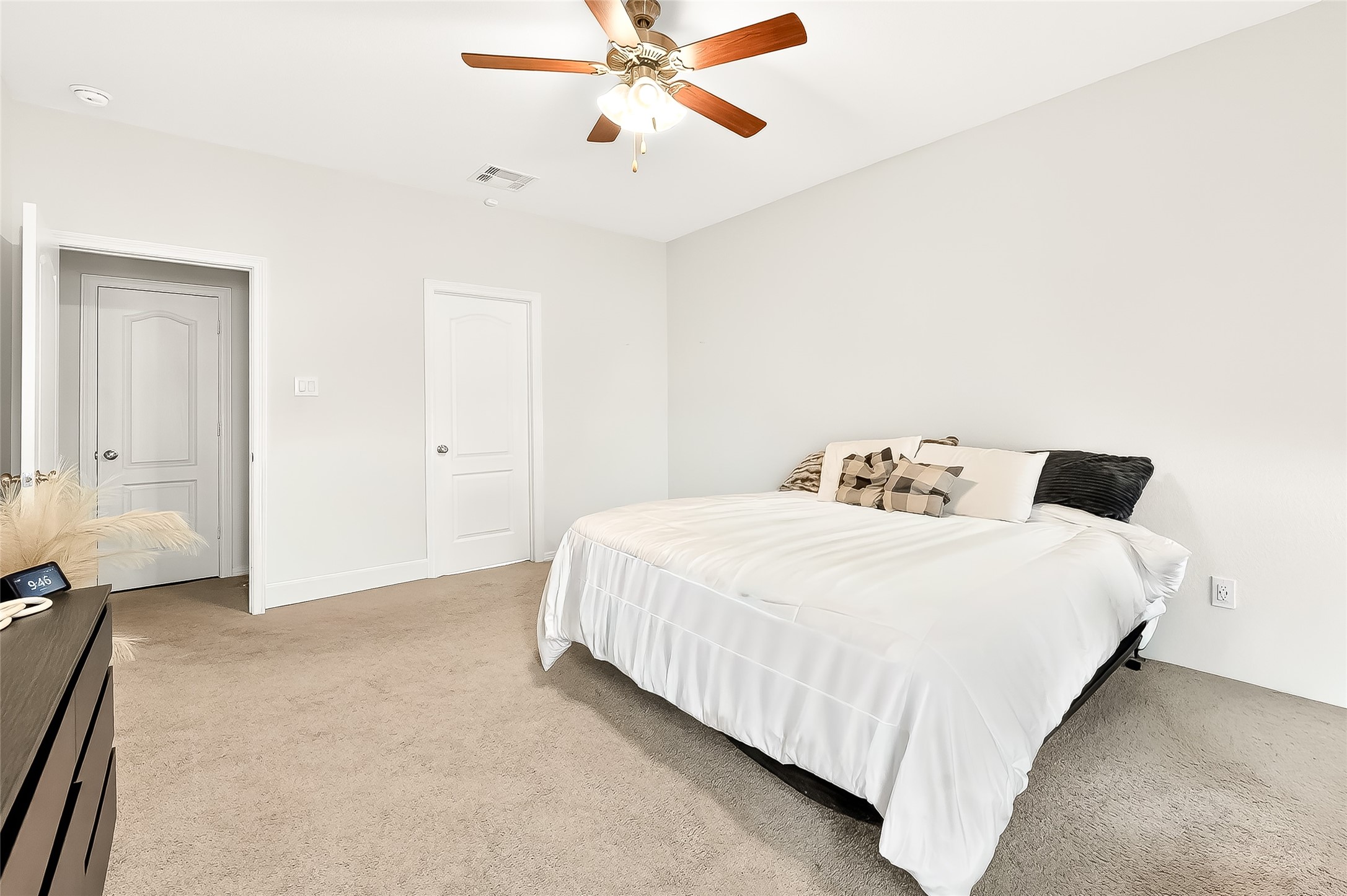 10023 Yanet Grove Lane Houston, TX 77044 - Photo 26 of 40 a bedroom with a bed and a chandelier