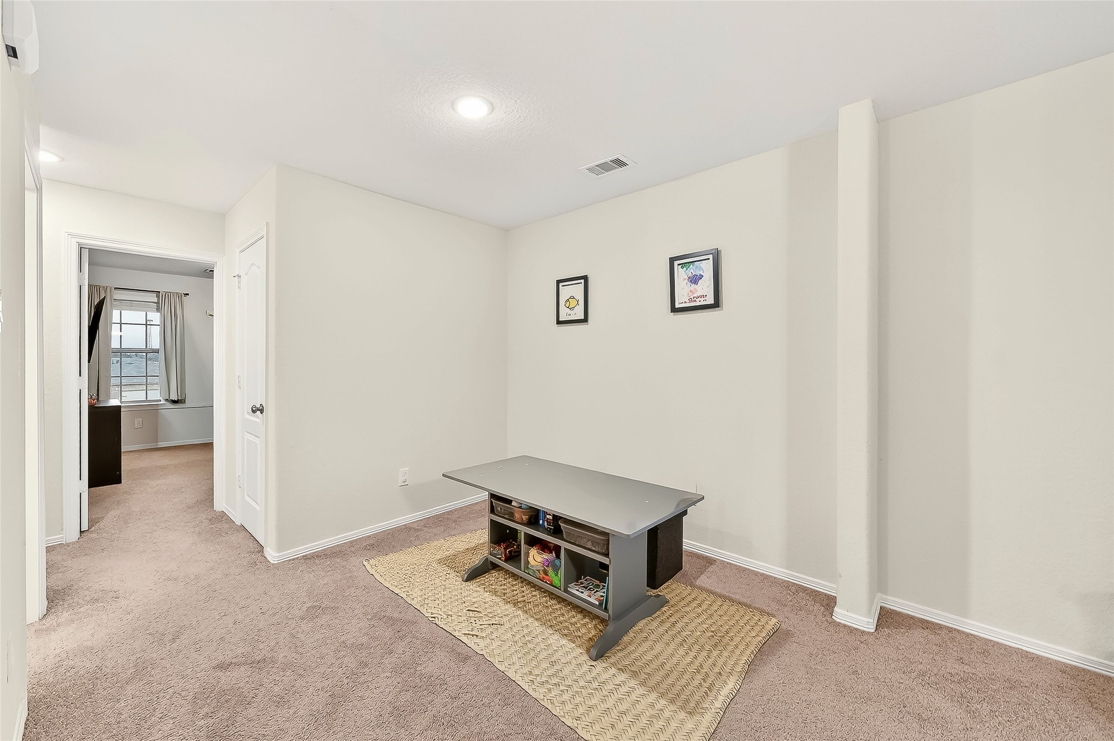 10023 Yanet Grove Lane Houston, TX 77044 - Photo 29 of 40 a living room with a bed furniture and a window