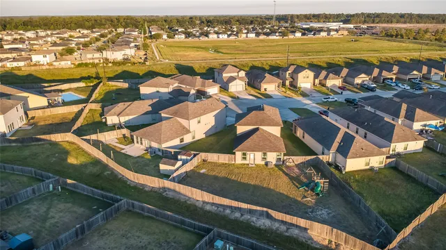 an aerial view of residential houses with outdoor space