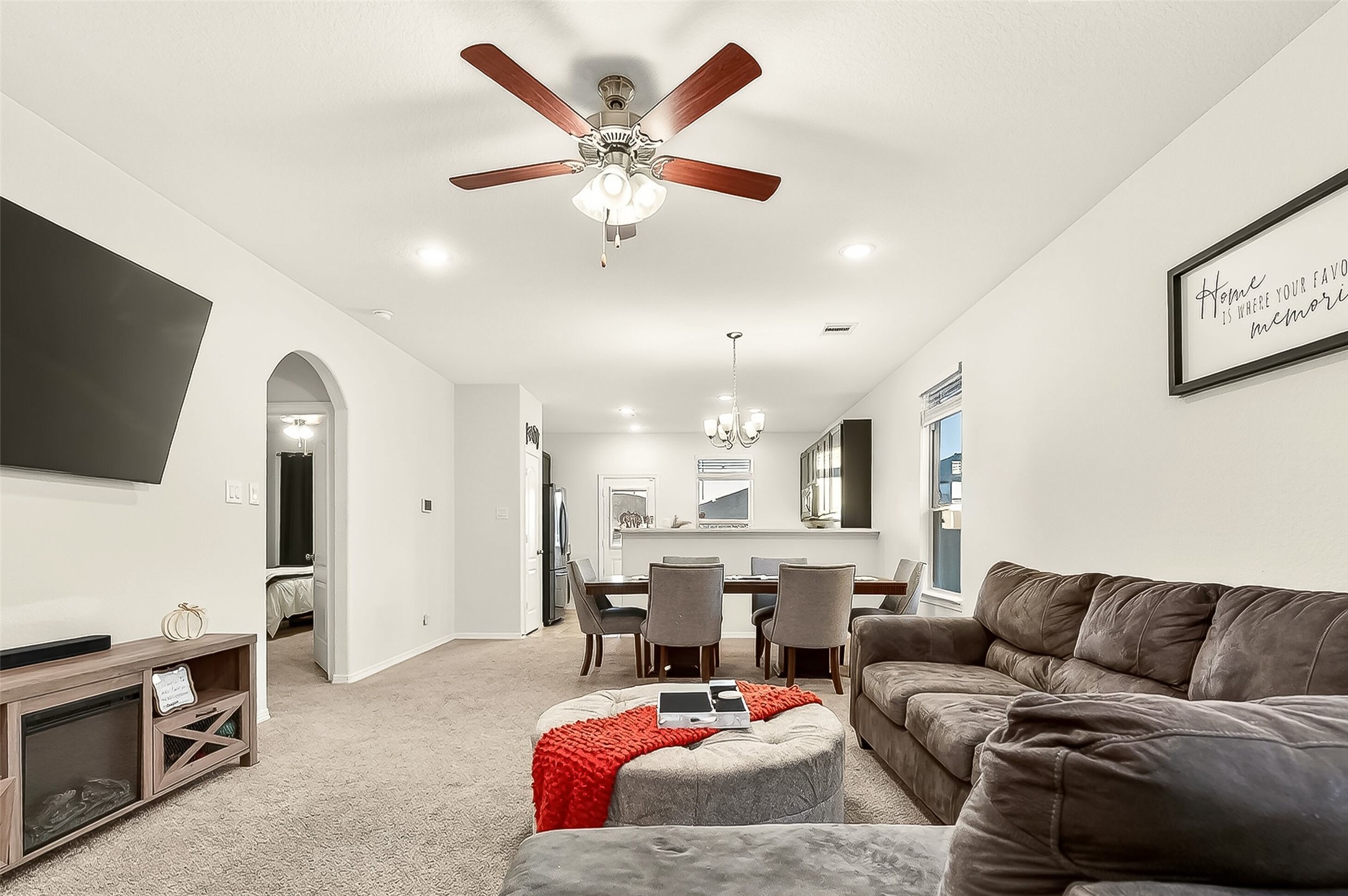 10023 Yanet Grove Lane Houston, TX 77044 - Photo 6 of 40 a living room with furniture and a flat screen tv