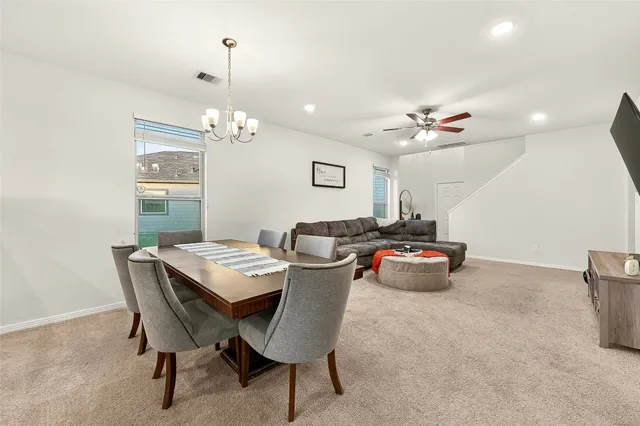 a view of a dining room with furniture