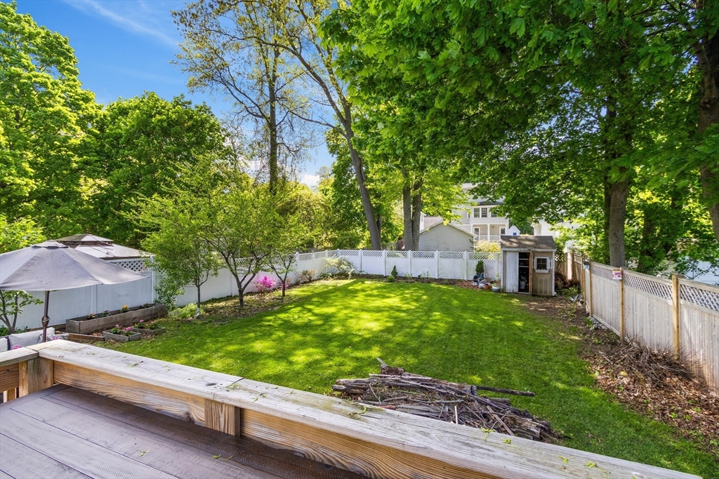 11 Hartlawn Road Boston, MA 02132 - Photo 27 of 34 a view of a backyard with a garden and trees