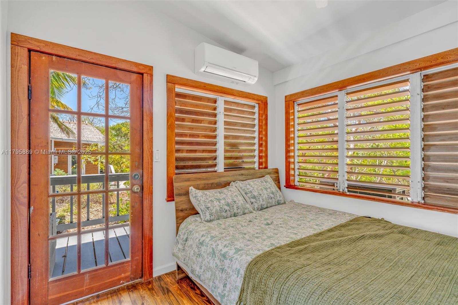 Lower Keys Big Pine Key, FL 33043 - Photo 11 of 43 a bed sitting in a bedroom next to a window