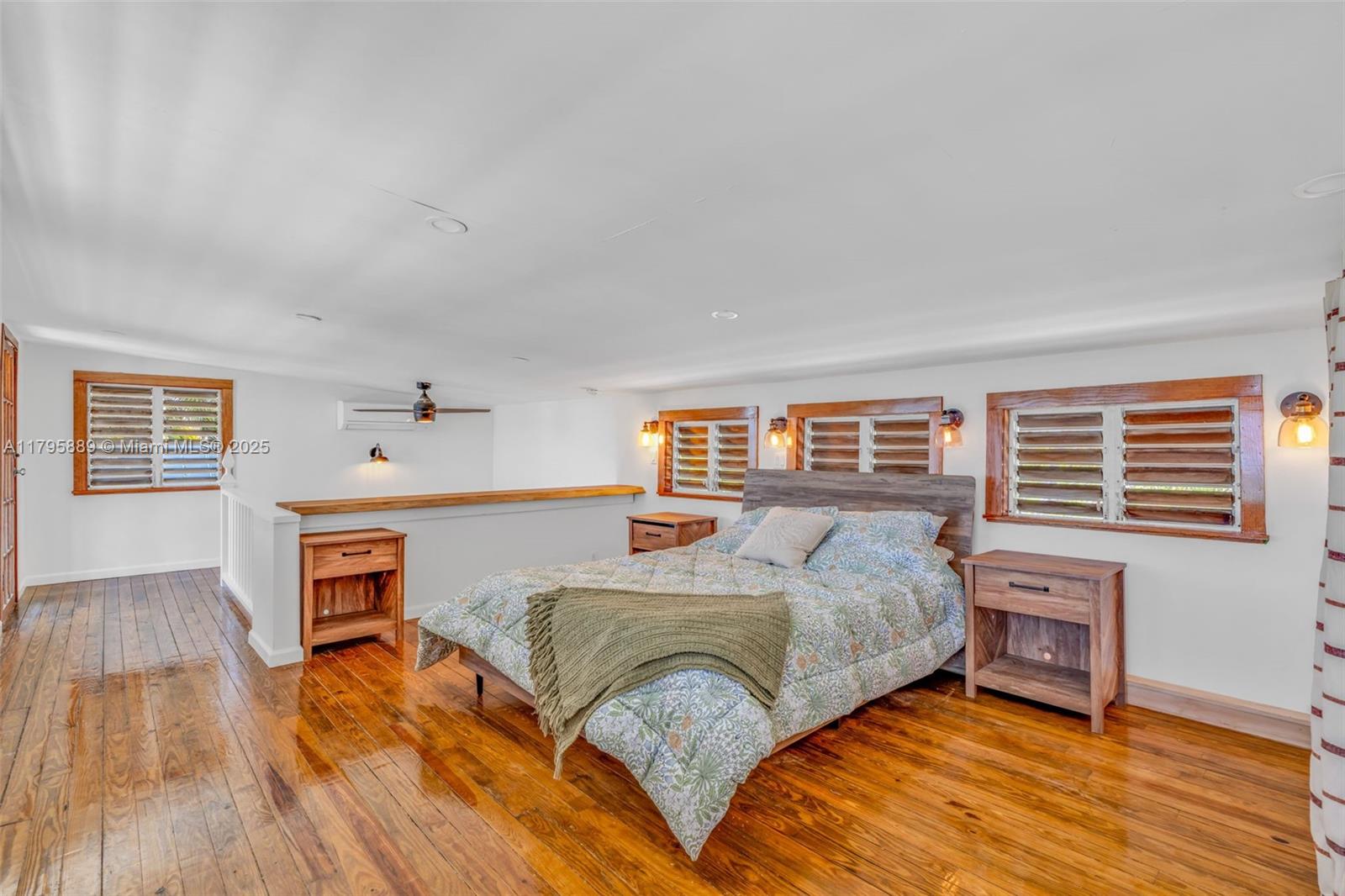 Lower Keys Big Pine Key, FL 33043 - Photo 15 of 43 a bedroom with a bed and wooden floor