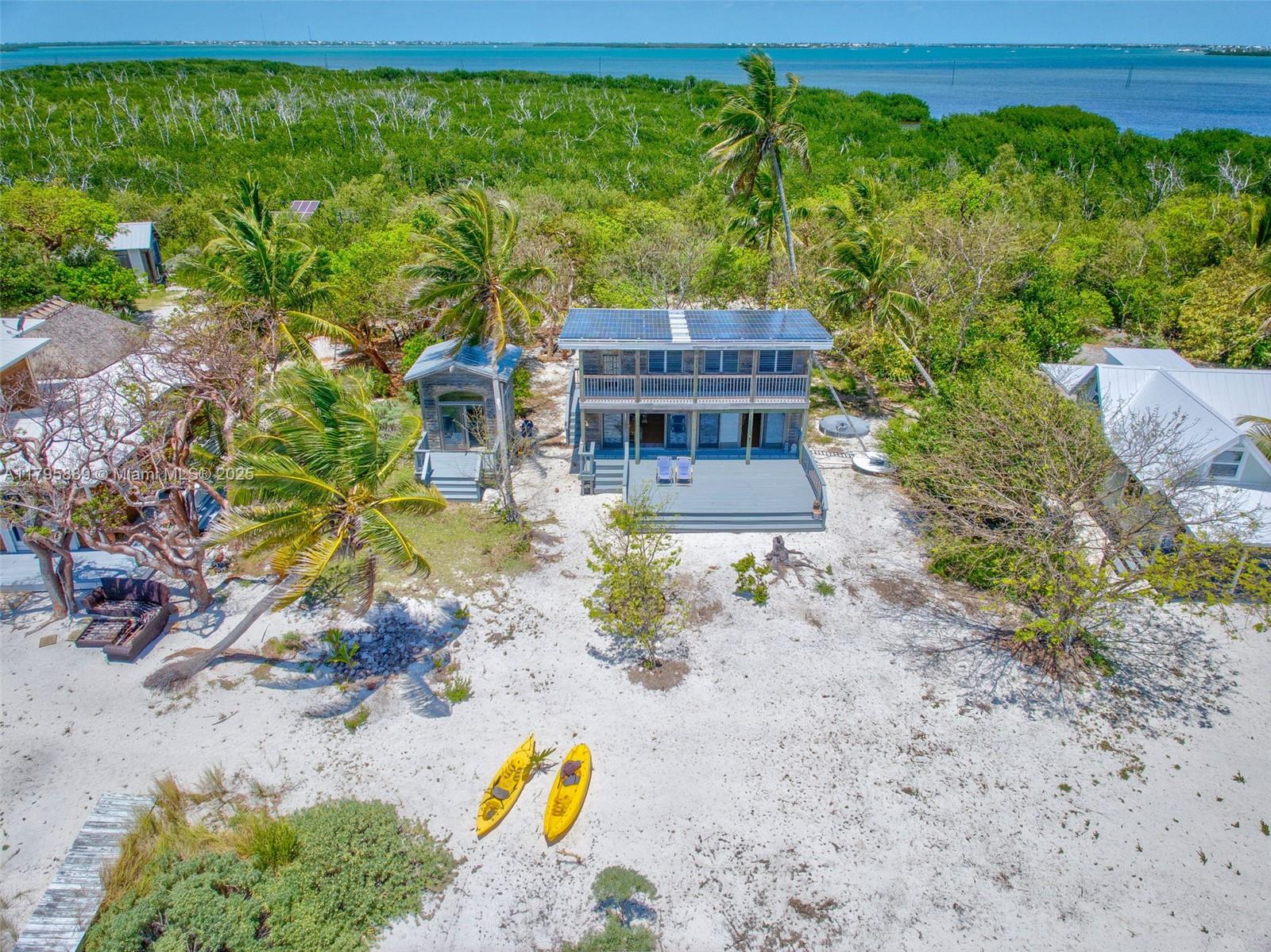 Lower Keys Big Pine Key, FL 33043 - Photo 2 of 43 a view of a backyard with plants and a patio