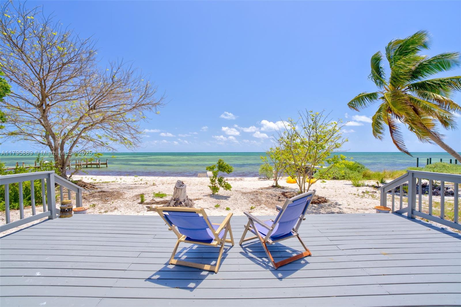 Lower Keys Big Pine Key, FL 33043 - Photo 21 of 43 a view of a patio with table and chairs and potted plants
