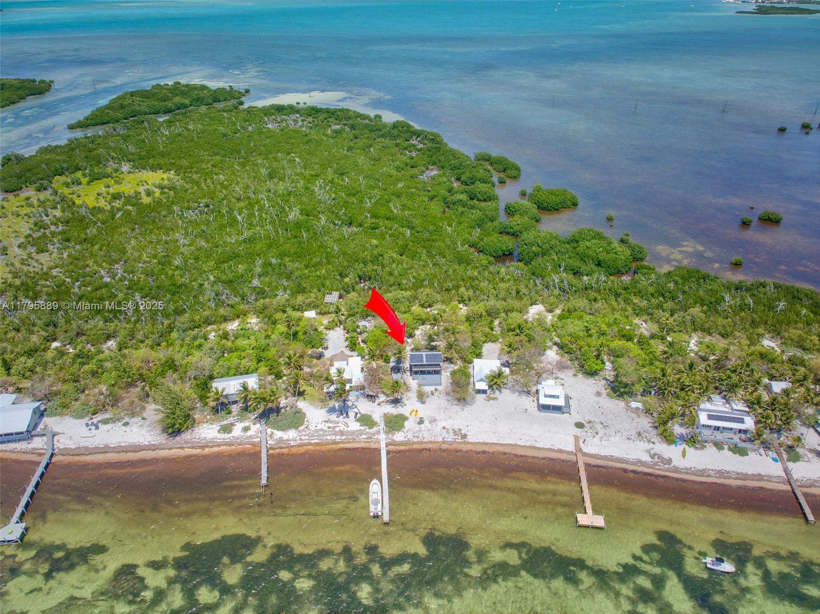 Lower Keys Big Pine Key, FL 33043 - Photo 37 of 43 a backyard of a house with lots of green space