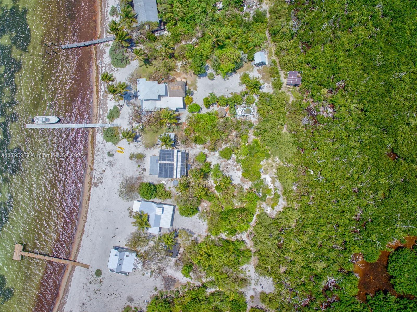 Lower Keys Big Pine Key, FL 33043 - Photo 42 of 43 a aerial view of a house with a yard