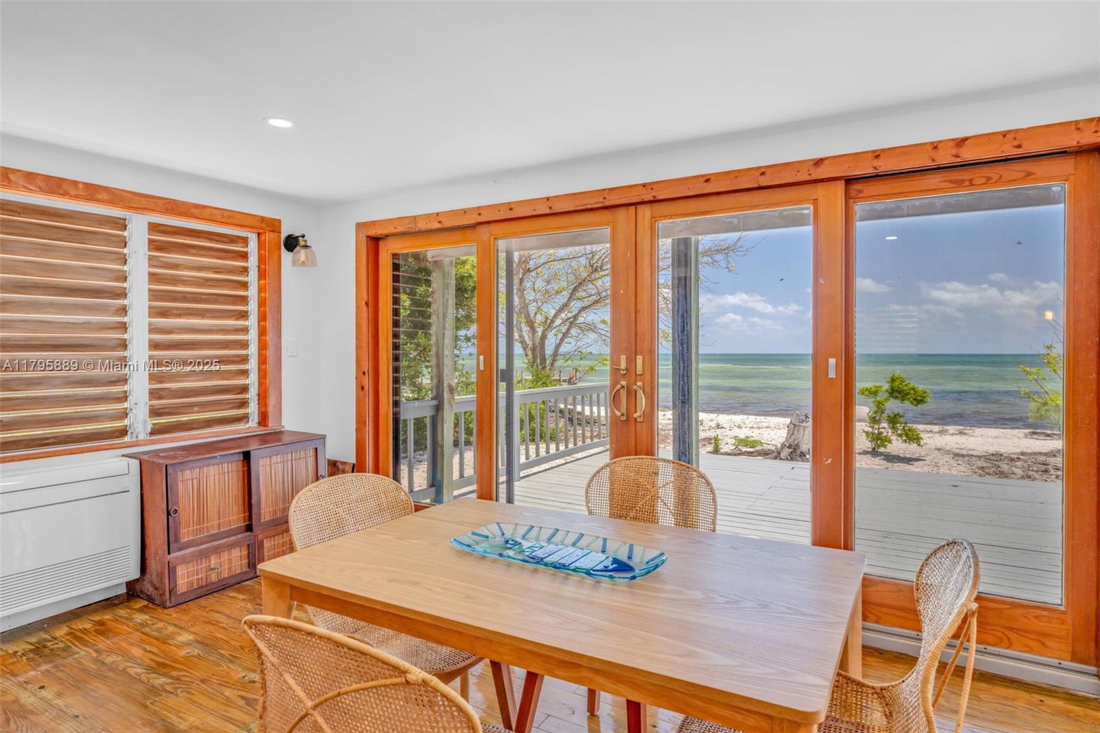 Lower Keys Big Pine Key, FL 33043 - Photo 7 of 43 a bedroom with a bed and glass windows