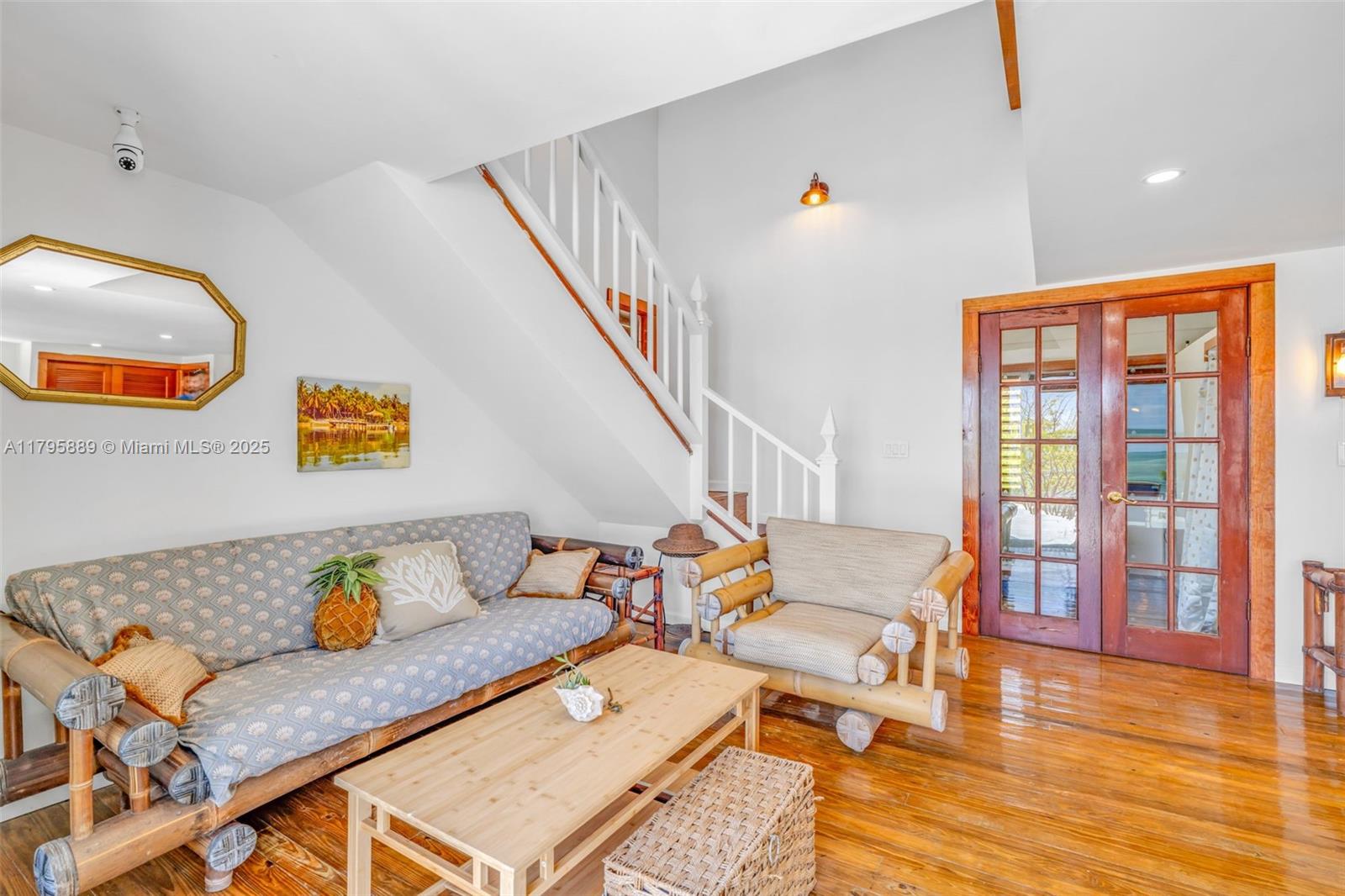 Lower Keys Big Pine Key, FL 33043 - Photo 10 of 43 a living room with dining room and wooden floor